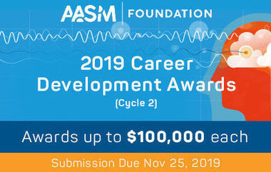 career development award text with orange human head form behind it